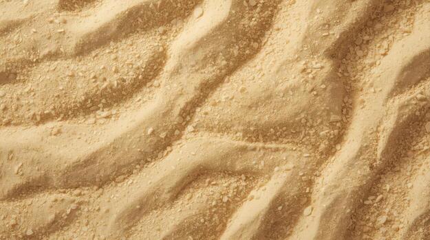 Warm inviting close up aerial showcases rippled sand texture with tiny rock fragments creating smooth beige and light brown desert background. photo