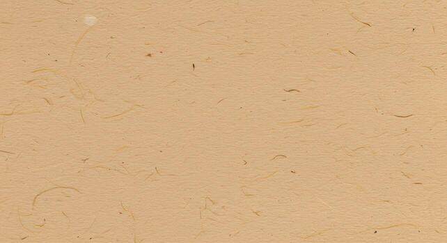 Detailed textured tan paper surface with natural fibers scattered across the s perfect for backgrounds and artistic design applications. photo