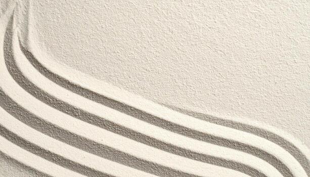 Top view of raked sand with curved lines creating a peaceful and minimalist zen garden pattern for meditation and relaxation session. photo