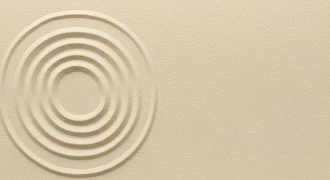 An elegant beige background with concentric circles creating a minimalist, textured, and aesthetically pleasing zen design element detail. photo