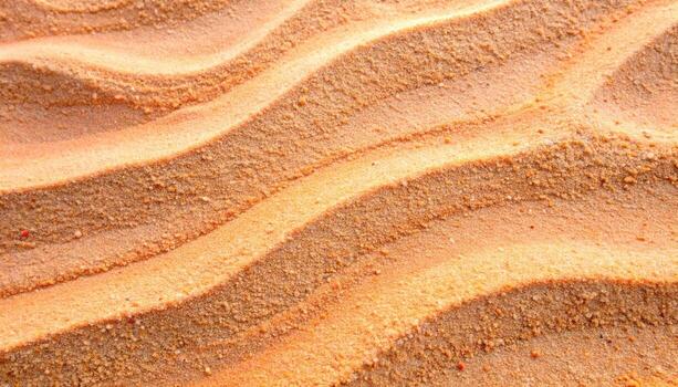 The gentle wind has sculpted subtle and calming wave patterns into the warm golden sand creating a serene and textured desert landscape. photo