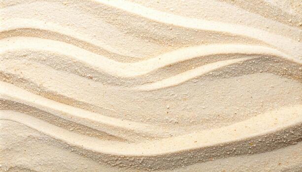 A rippled pattern in the light tan colored sand creates a soft and calming natural texture perfect for use as an abstract backdrop image. photo