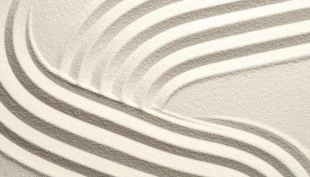 Top view of sand with beautiful curvy lines illuminated by gentle light creating a calming zen garden abstract pattern concept design. photo