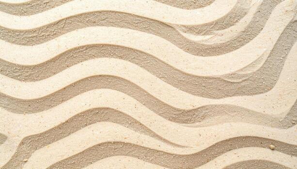 Top-down view shows symmetrical, peaceful, and abstract curving lines in sand resembling beach waves in light beige and white hues. photo
