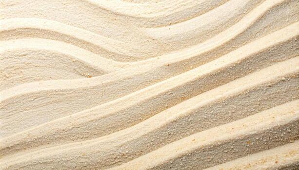 The serene beige sand shows repeating wave patterns created by a zen garden rake, bing a sense of calm and meditative texture to the scene. photo