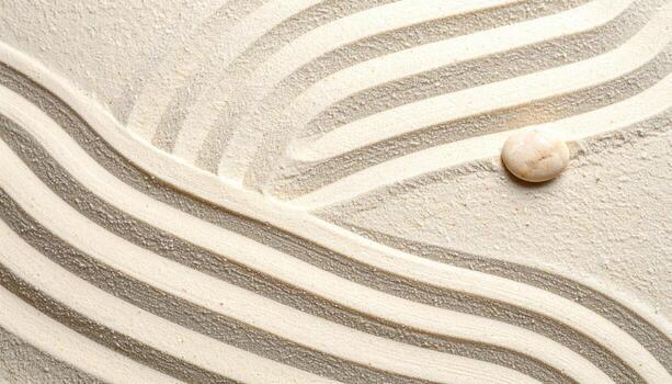 A smooth stone rests on textured sand with flowing raked patterns creating a calming zen garden background for meditation or relaxation. photo