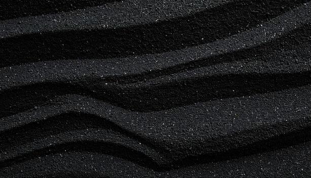 un resumen cerca arriba de ondulado negro arena textura creando rítmico patrones con ligero y sombra en un oscuro granular superficie en naturaleza. foto