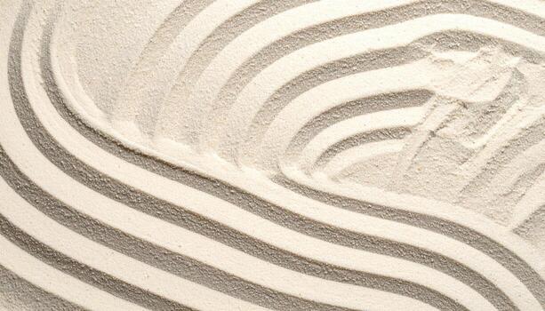 A beautiful zen garden pattern with curved lines raked into fine white sand creates a calming and peaceful textured background design element. photo