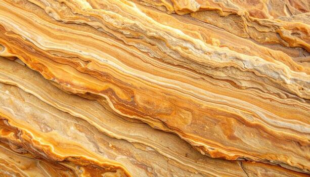 The mesmerizing rock formation displays beautiful natural patterns with layers of beige, brown, and gold swirled in an artistic arrangement. photo