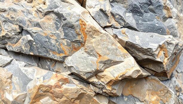 Detailed close-up shows grey and brown rock formations creating a rugged textural mountain background with natural stone patterns present now. photo
