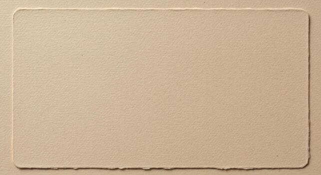 A textured rectangular shape with deckle edges on a flat background creates an elegant space ideal for displaying unique designs and artworks. photo