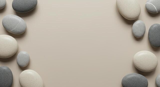 Elegant arrangement of smooth, neutral colored stones creates a natural, calming border around a serene, soft beige background space. photo
