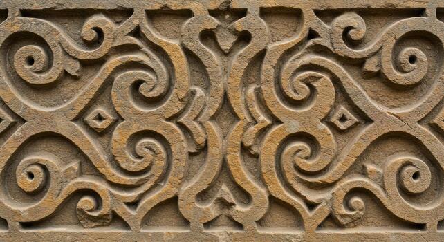 The ancient sandstone carving displays intricate symmetrical patterns, showcasing the rich artistic traditions of a bygone era in exquisite detail. photo