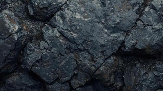 The rugged dark rock formations create a textured abstract background, perfect for adding depth and visual interest to your design projects. photo