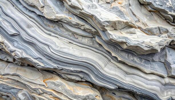 Close up of the layered sedimentary rock showing intricate patterns and textures created by geological processes over millions of years outdoors. photo