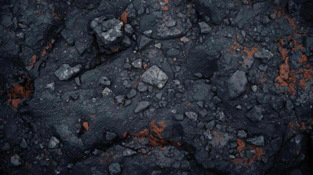 Close up shot of cracked asphalt surface texture with stones and red dirt creating interesting abstract design for backgrounds and overlays. photo