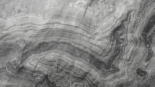 Abstract gray marble stone texture displays swirling layers and natural pattern formations creating a visually striking and organic background photo