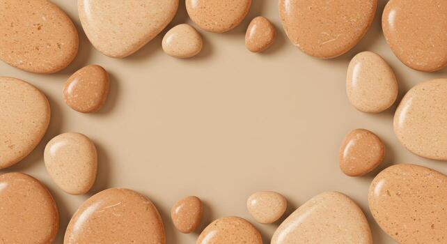 Polished pebbles in warm neutral tones form a decorative border around a plain background providing space for creative design elements. photo