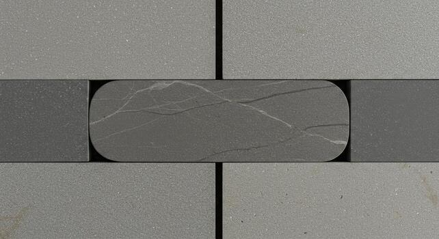 Elegant dark gray stone accent tile contrasts with textured light gray rectangular tiles in this sleek minimalist architectural design project. photo