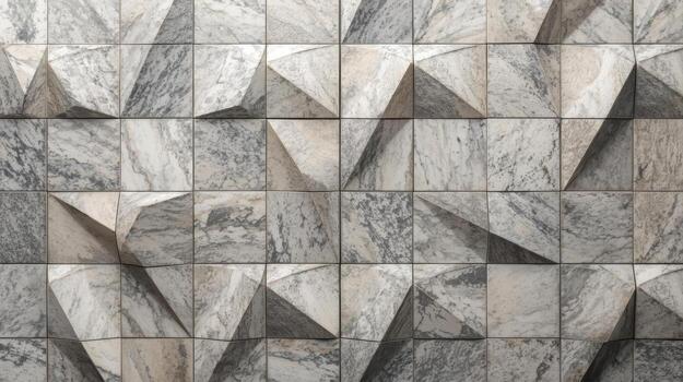 Textured wall paneling featu geometric and pyramidal shapes creates a three dimensional surface, with a marble like natural stone finish. photo