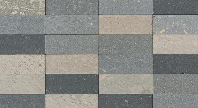 A horizontally stacked arrangement of rectangular stones featu various gray and beige shades creating a textured architectural surface design. photo