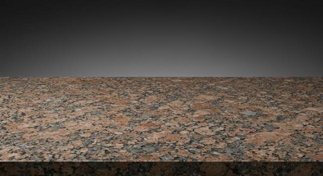 Beige granite countertop surface exhibiting a speckled pattern against a dark gray gradient background in a studio setting for product display. photo