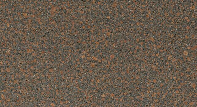 Close-up of a speckled brown granite surface reveals texture and small mineral inclusions in this natural stone for countertops. photo