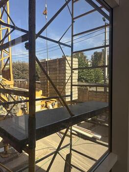 crane with concrete slabs construction site view from inside photo