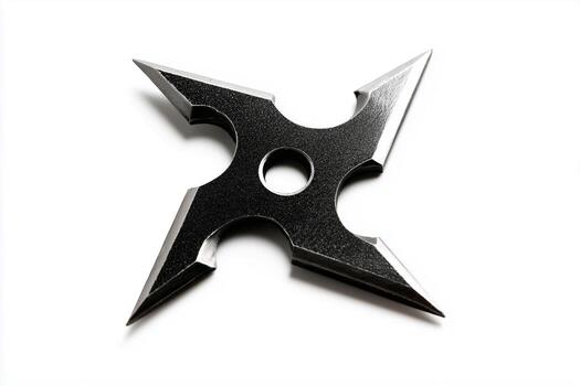 Ninja throwing star shuriken displaying classic design and sharp edges on a plain background photo
