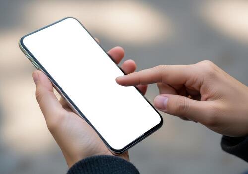 Person holding a smartphone and touching the blank screen photo
