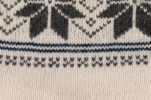 A knitted item with a pattern of squares and triangles photo