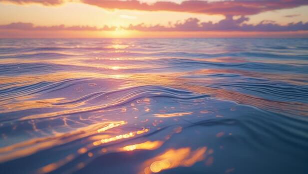 Tranquil ocean surface reflecting a vibrant pastel sunset with soft wave patterns photo