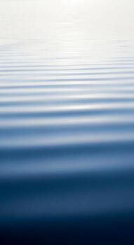 Abstract horizontal lines of blue and white create a calming serene visual of rippling water or a textured sky photo