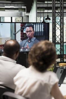 Team members attends an online call meeting with applicant, evaluating past work experience and abilities suitable for empty position requirements. Remote employment process. photo