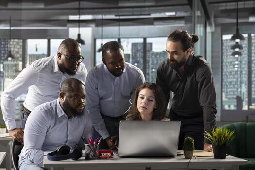 Coworkers engaged in consulting and report sharing at workplace. Professional team reviews visual data and documents to enhance business strategy and performance goals for monthly targets. photo