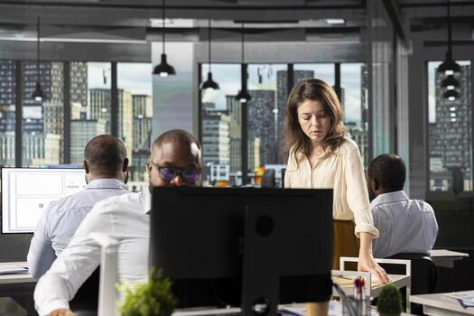Secretary bringing archived files and reports to colleagues in workplace, pushing trolley with multiple folders. Employees studying old insights for business intel and risk assessment. photo