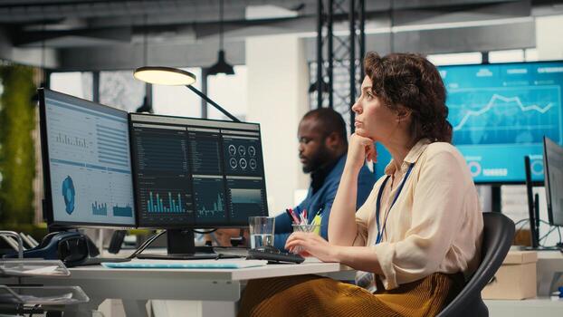 Business consultant focusing on global expansion strategy and planning resource allocation for organization, using digital tools to forecast insights and achieve corporate growth. Camera B. photo