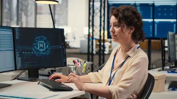 Woman employee using AI machine learning for efficiency recognition, using a synergy of data sharing and optimization models in a co working space. IT company artificial intelligence. photo
