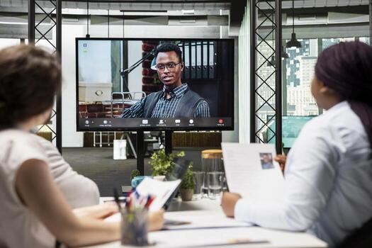 Recruitment process continues as a job seeker participates in an online interview, answering questions and connecting with the HR employees through secure network and screen sharing platform. photo
