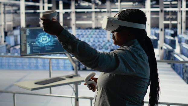 Data center IT expert investigates AI configurations using virtual reality, making adjustments for optimal function. Server hub engineer checks artificial intelligence error using VR headset, camera B photo