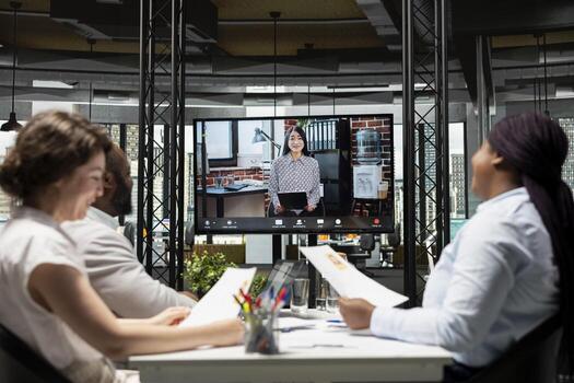 HR team conducting a web call interview with candidate via modern web connection, evaluating the experience and qualifications on CV. Career potential for the organization position. photo