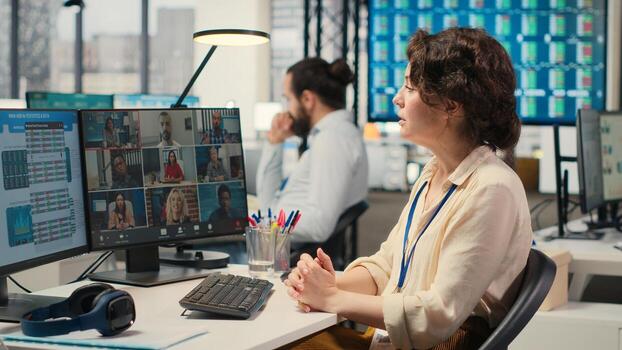 Employees sharing ideas on a web conference call at the workstation, discussing about project briefing with charts and reports. Business associates attending online meeting event. Camera B. photo
