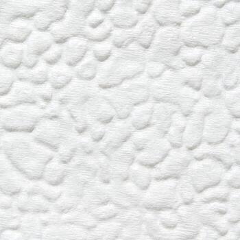 White textured surface with bumpy pattern creating stone-like appearance. photo