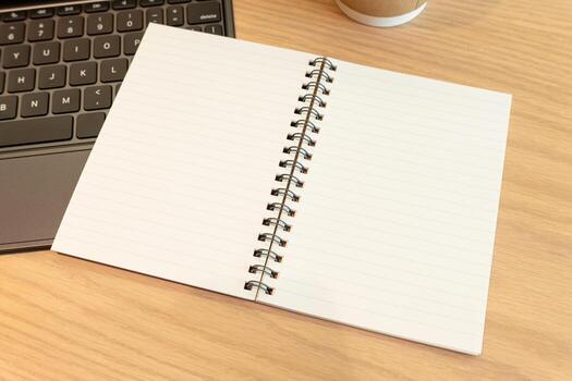 Blank Notebook for text on Wooden Desk with Laptop and Coffee. concepts to work, study, planning, writing, journaling, or creative brainstorming in a cozy workspace environment. photo