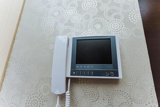 stylish intercom with white handset, contemporary intercom featuring minimalist design and security photo