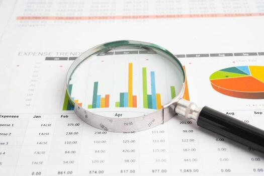 Magnifying glass on charts graphs paper. Financial development, Banking Account, Statistic, Investment Analytic research data ec photo