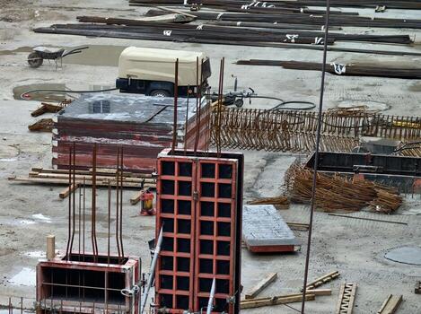 overview of building area logistics, summary of construction progress with materials and staging photo