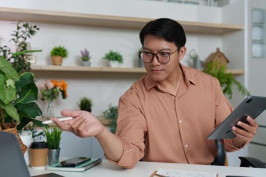 Digital Strategy. Professional discussing financial insights using tablet in modern office. photo