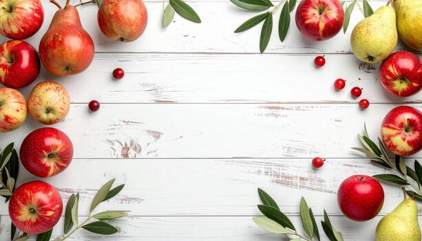 Autumn fruit frame with apples pears and cranberries on a white wooden background. Top view with copy space for text. photo
