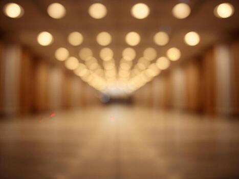 An abstract blurred background of a long hallway with warm ceiling lights creating a beautiful bokeh effect. photo